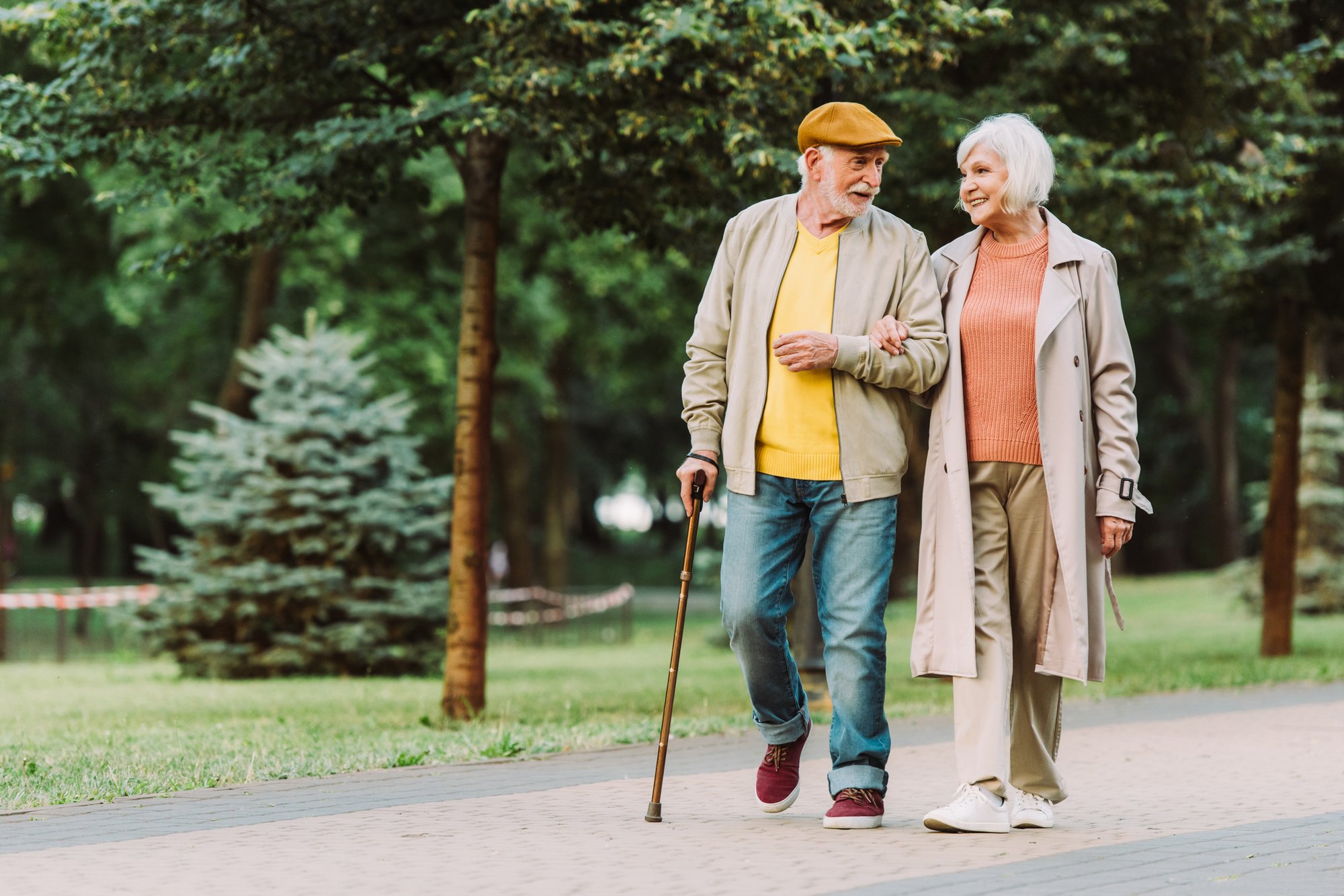Retired Couple Taking a Leisurely Walk Retired Couple Taking a Leisurely Walk
